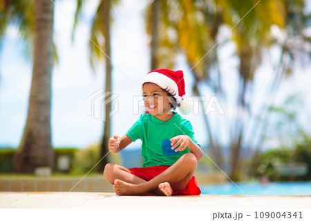 Christmas vacation on tropical island. Xmas kids. 109004341