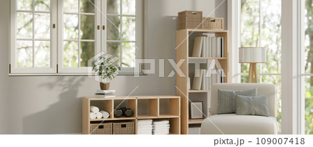 Interior design of a minimal Scandinavian living room with a cosy armchair, a wooden bookshelf 109007418