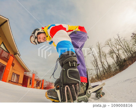 A daring man conquers snowy slopes with style, showcasing skill and thrill as he maneuvers on a snowboard, capturing the essence of winter adventure 109008816