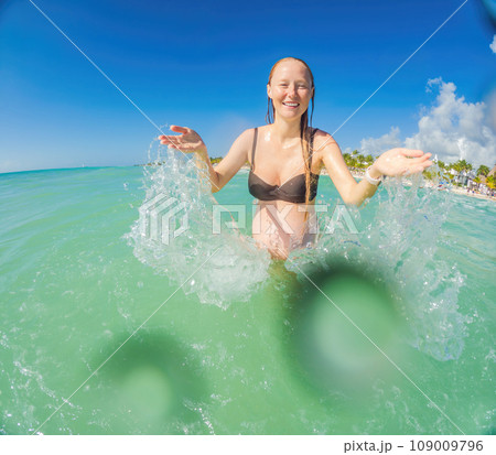 A radiant pregnant woman revels in the serenity of the turquoise sea, embracing the soothing waves as she celebrates the beauty of impending motherhood A radiant pregnant woman revels in the serenity of the turquoise sea, embracing the soothing waves as she celebrates the beauty of impending motherhood 109009796