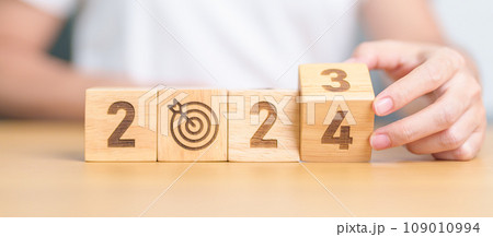 2023 year change to 2024 year block with dartboard icon. Goal, Target, Resolution, strategy, plan, Action, mission, motivation, and New Year start concepts 2023 year change to 2024 year block with dartboard icon. Goal, Target, Resolution, strategy, plan, Action, mission, motivation, and New Year start concepts 109010994