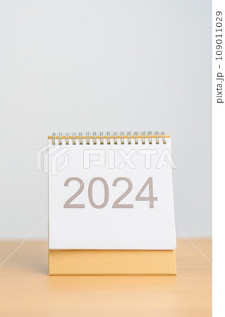 2024 Year Calendar on table background. Happy New Year, Resolution, Goals, Plan, Action, Mission and financial Concept 2024 Year Calendar on table background. Happy New Year, Resolution, Goals, Plan, Action, Mission and financial Concept 109011029