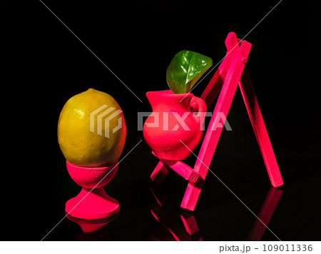 Composition with lemon at the easel on a black background 109011336