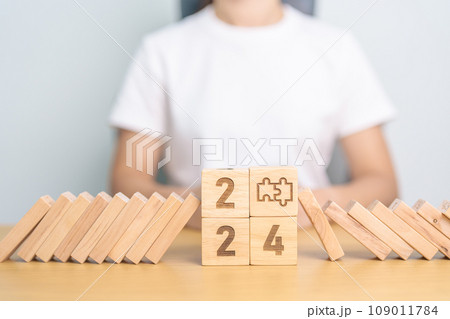 2024 year and falling blocks with jigsaw puzzle icon. Team, teamwork, Goal, mission, strategy, plan, Action, partnership, Risk Management, recession, goal, New Year planning and inflation economy 2024 year and falling blocks with jigsaw puzzle icon. Team, teamwork, Goal, mission, strategy, plan, Action, partnership, Risk Management, recession, goal, New Year planning and inflation economy 109011784