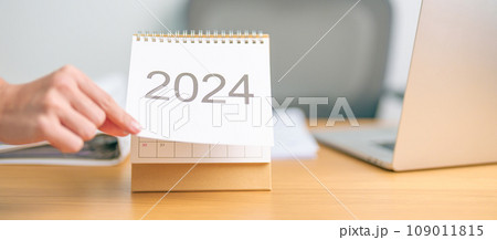 2024 Year Calendar on table background. countdown, Happy New Year, Resolution, Goals, Plan,  Action, Mission and financial Concept 109011815