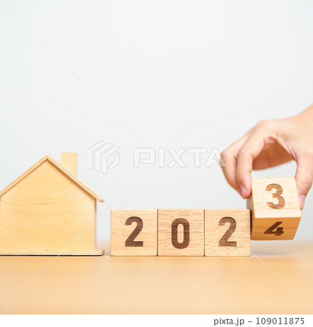 hand flip 2023 to 2024 block with house model. real estate, Home loan, tax, investment, financial, savings and New Year Resolution concepts hand flip 2023 to 2024 block with house model. real estate, Home loan, tax, investment, financial, savings and New Year Resolution concepts 109011875