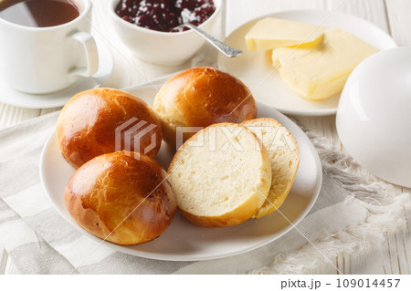 Hveteboller Norwegian Cardamom Sweet Buns served with butter, jam and coffee closeup. Horizontal 109014457