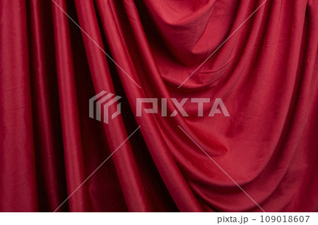 Texture, background, template. Silk fabric. Red silk drapery and upholstery fabric. Solid fabrics for backdrop, drapes, flags and curtains Texture, background, template. Silk fabric. Red silk drapery and upholstery fabric. Solid fabrics for backdrop, drapes, flags and curtains 109018607