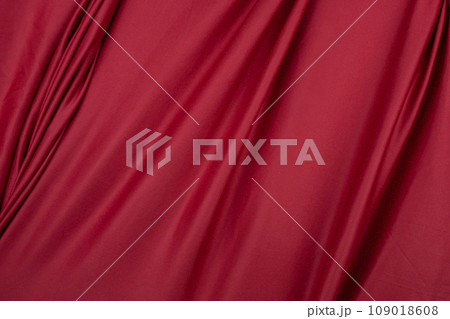 Texture, background, template. Silk fabric. Red silk drapery and upholstery fabric. Solid fabrics for backdrop, drapes, flags and curtains Texture, background, template. Silk fabric. Red silk drapery and upholstery fabric. Solid fabrics for backdrop, drapes, flags and curtains 109018608