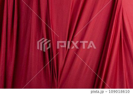 Texture, background, template. Silk fabric. Red silk drapery and upholstery fabric. Solid fabrics for backdrop, drapes, flags and curtains Texture, background, template. Silk fabric. Red silk drapery and upholstery fabric. Solid fabrics for backdrop, drapes, flags and curtains 109018610