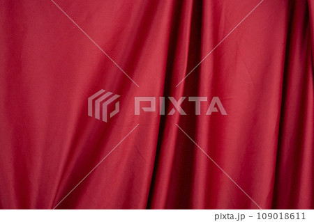 Texture, background, template. Silk fabric. Red silk drapery and upholstery fabric. Solid fabrics for backdrop, drapes, flags and curtains Texture, background, template. Silk fabric. Red silk drapery and upholstery fabric. Solid fabrics for backdrop, drapes, flags and curtains 109018611