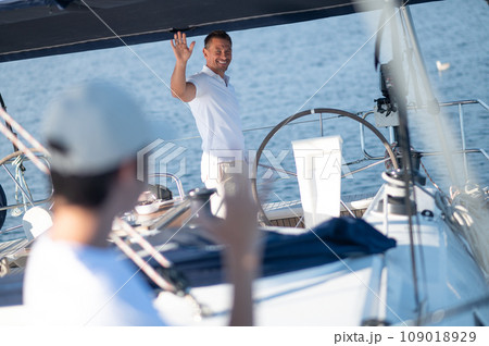 Dad and son spending time together on the yacht and fisihing 109018929