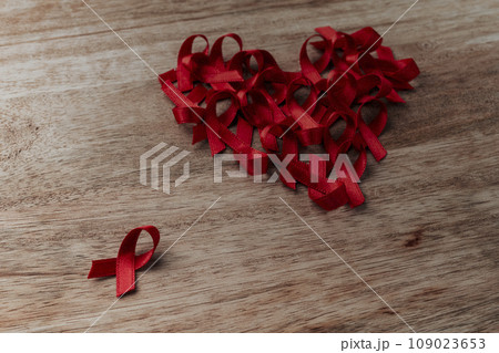 heart of red ribbons on a table 109023653