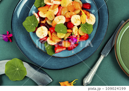 Tasty fruit salad with edible nasturtium. Tasty fruit salad with edible nasturtium. 109024199