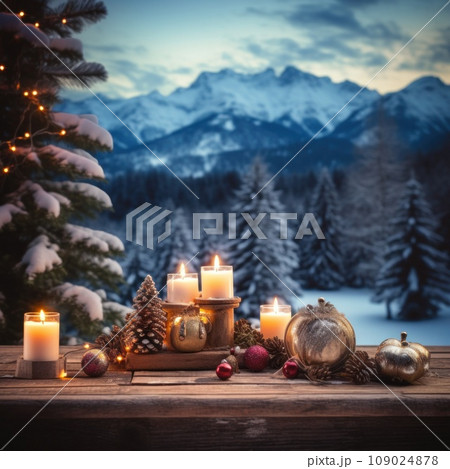 A rustic wooden table with Christmas decorations and candles 109024878