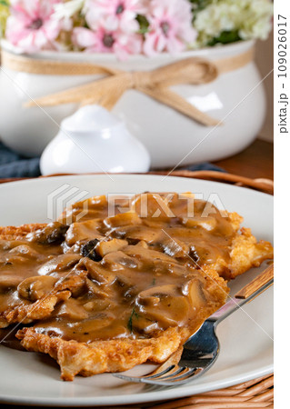 Sauerkraut pancakes /fuczka/ with mushroom sauce . 109026017
