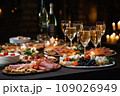 Light snacks in a plate on a buffet table. Assorted mini canapes, delicacies and snacks, restaurant food at event. A gala reception. Decorated delicious table for a party goodies. 109026949