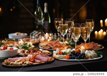 Light snacks in a plate on a buffet table. Assorted mini canapes, delicacies and snacks, restaurant food at event. A gala reception. Decorated delicious table for a party goodies. 109026949