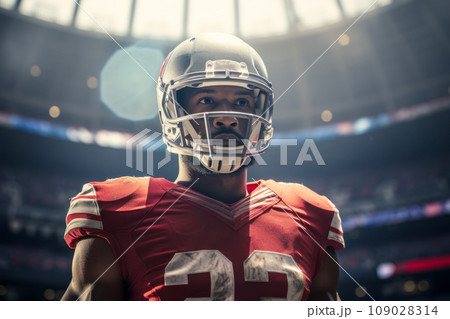 American football player of African descent in red uniform and helmet on a field American football player of African descent in red uniform and helmet on a field 109028314