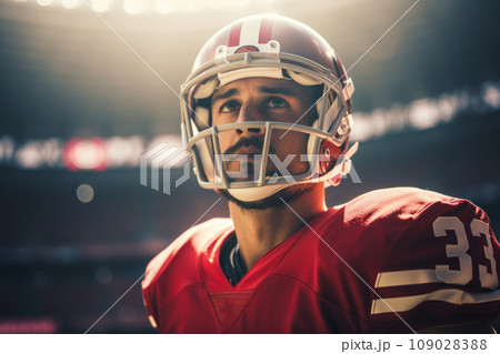 White American football player in red uniform and a helmet on a field 109028388