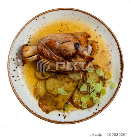 Stewed knuckle with potato served in a plate Stewed knuckle with potato served in a plate 109029264