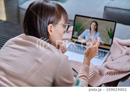 Online mental therapy, remote meeting of middle aged woman with psychologist Online mental therapy, remote meeting of middle aged woman with psychologist 109029802