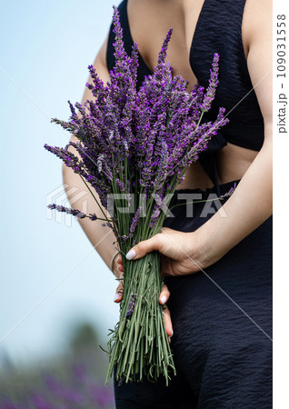 A girl with a fragrant lavender bouquet A girl with a fragrant lavender bouquet 109031558