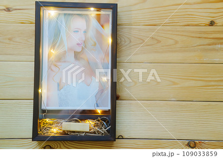 packing wedding photos in a beautiful wooden box. packing wedding photos in a beautiful wooden box. 109033859