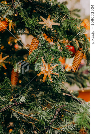 Christmas fir tree decorations with red and gold baubles. New Year celebration concept Christmas fir tree decorations with red and gold baubles. New Year celebration concept 109033904