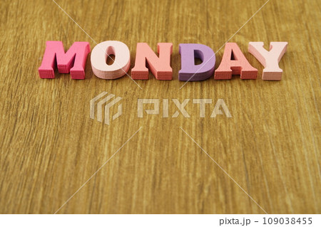 colorful monday alphabet letters on wooden background 109038455
