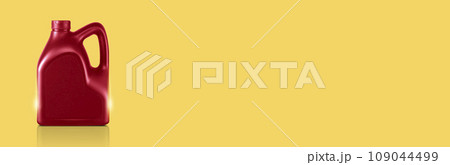 canisters of lubricating oil or motor oil on yellow background canisters of lubricating oil or motor oil on yellow background 109044499