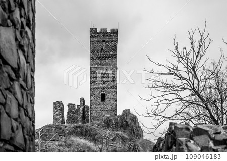 White Tower of Hazmburk - medieval castle in Central Bohemian Uplands, Czech Republic. Black and white photography. White Tower of Hazmburk - medieval castle in Central Bohemian Uplands, Czech Republic. Black and white photography. 109046183