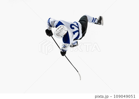 Game on. Top view. Young man, hockey player in motion during game, championship against white studio background 109049051