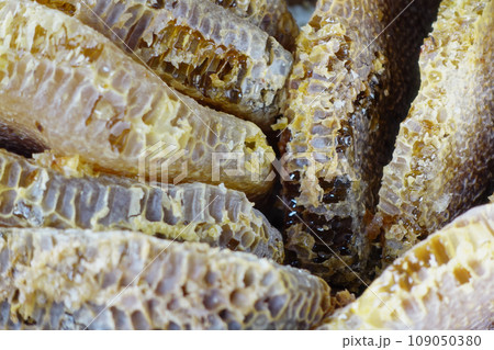 close up of fresh honey with comp in a jar close up of fresh honey with comp in a jar 109050380