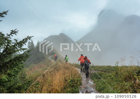 Group of backpacker walking on trail in foggy mountain on the morning at Switzerland 109050526