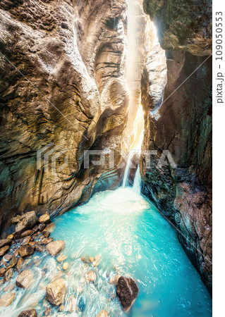 Waterfall with light shines in Rosenlaui glacier gorge at Bernese Alps, Switzerland Waterfall with light shines in Rosenlaui glacier gorge at Bernese Alps, Switzerland 109050553