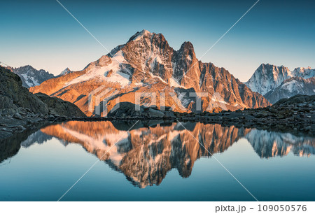 French alps landscape of Lac Blanc with Mont Blanc mountain range reflected on lake in the sunset at Chamonix, France French alps landscape of Lac Blanc with Mont Blanc mountain range reflected on lake in the sunset at Chamonix, France 109050576