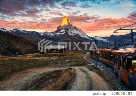 View of sunrise on Matterhorn mountain during the train ride up to Gornergrat at Zermatt, Switzerland View of sunrise on Matterhorn mountain during the train ride up to Gornergrat at Zermatt, Switzerland 109050584