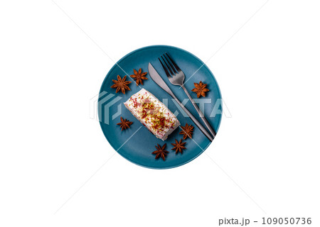 A piece of delicious sweet meringue roll with mascarpone cheese, berries and almonds A piece of delicious sweet meringue roll with mascarpone cheese, berries and almonds 109050736