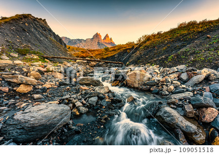 Landscape of iconic three peak and waterfall flowing of Aiguilles dArves in French alps at Savoie, France Landscape of iconic three peak and waterfall flowing of Aiguilles dArves in French alps at Savoie, France 109051518