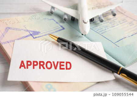 Approved Stamp visa and passport document to immigration at airport in country. 109055544