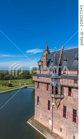Top view of the largest castle in the Netherlands, De Haar. A beautiful quadcopter flight over the castle, the park and the water moat around the castle. A beautiful park in English style. Top view of the largest castle in the Netherlands, De Haar. A beautiful quadcopter flight over the castle, the park and the water moat around the castle. A beautiful park in English style. 109057545