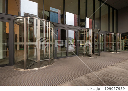 Facade of modern Business Center with glass doors Facade of modern Business Center with glass doors 109057989