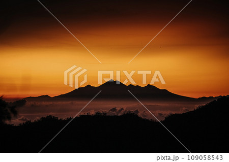 View of mountain with fog at sunset 109058543