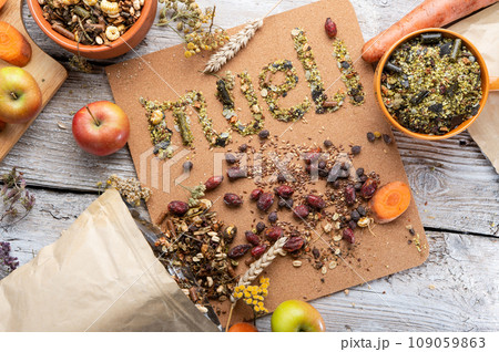 special muesli and granules for senior horses  served in bowl around muesli background.  . feeding and horse care concept. 109059863