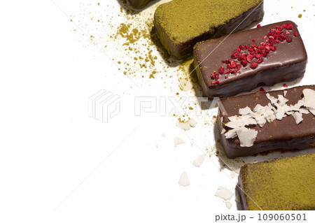 Healthy vegan bars with carob and dried fruits on white background 109060501