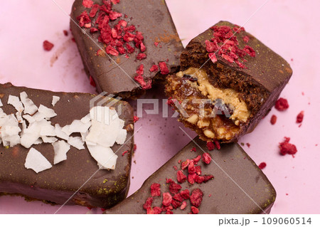 Vegan chocolate bar with dried fruits close-up Vegan chocolate bar with dried fruits close-up 109060514