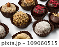 Set of round chocolate candies with nuts on a white background 109060515