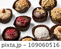 Set of round chocolate candies with nuts on a white background 109060516