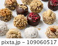 Set of round chocolate candies with nuts on a white background 109060517